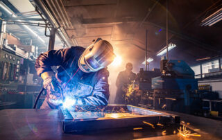 Man welding wth welding gloves on