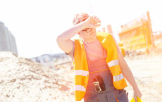 Construction worker sweating under the sun - Beat the Heat How to Stay Cool at a Construction Site